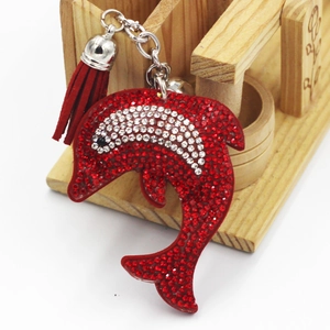 Porte-clés dauphin scintillant avec strass rouges et blancs et pompon pour sacs