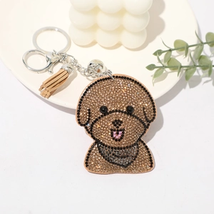 Porte-clés chien teddy en strass brillants avec pompon en cuir marron clair et anneau argent