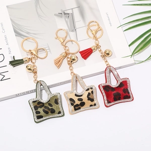 Porte-clés Mini Sac Imprimé Léopard Mode pour Femmes Charme de Sac à Gland en Strass et Velours Coréen Pendentif en Métal Alliage Accessoire de Porte-clés