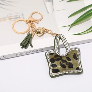 Porte-clés mini sac chic avec imprimé léopard, pompon émeraude et strass brillants