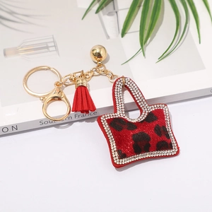 Porte-clés mini sac à imprimé léopard rouge avec pompons et strass étincelants