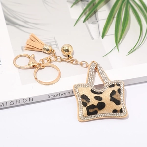 Porte-clés sac à main léopard avec pompon doré et strass pour accessoires