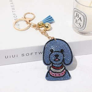 Porte-clés chien teddy en strass bleus avec chaîne dorée et pompon élégant