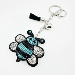 Sparkling crystal bee keychain with black leather tassel and silver-tone accessories
