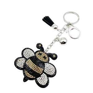 Sparkling crystal bee keychain with black leather tassel and gold metallic ring hardware