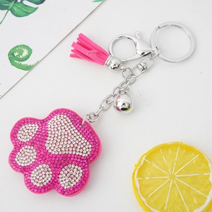 Glitzernder Strass-Bärentatzen-Schlüsselanhänger mit rosa Quaste und kleiner Glocke