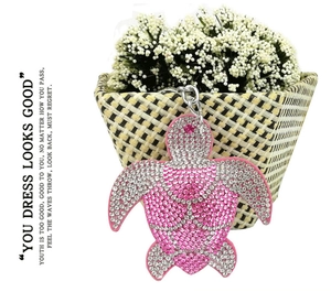 Detail of pink crystal turtle keychain with sparkling rhinestones and silver metal hook