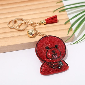 Classic red rhinestone cartoon dog keychain with gold tassel and bell accessory