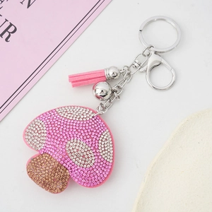 Sparkling mushroom keychain with pink rhinestones and matching suede fringe tassel