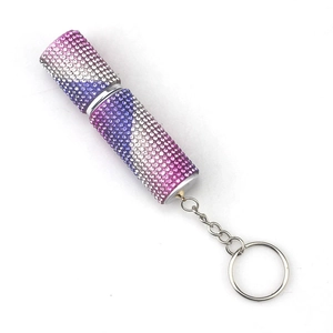 Macro shot of 10ml mini perfume spray bottle with gradient rhinestones and keychain