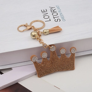 Sparkling crown keychain with crystal rhinestones, golden metal chain and brown tassel charm