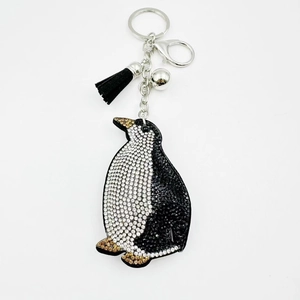 Crystal penguin keychain with black and white rhinestones, silver bell and tassel