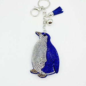 Sparkling penguin rhinestone keychain with blue suede tassel and silver bells