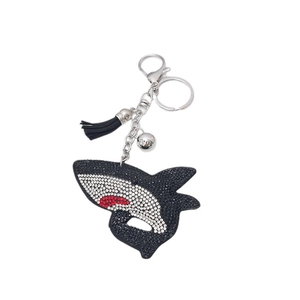 Sparkling crystal shark keychain with black leather tassel and silver bell accessory