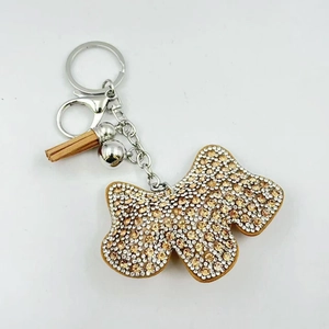 Portachiavi a farfalla lucido con strass champagne, nappa e anello argento