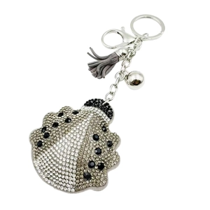 Porte-clés coquillage en cristal étincelant avec pompon en cuir gris et clochette