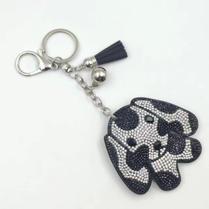 Porte-clés chien mignon en cristal avec pompon en cuir noir et anneau en métal argenté