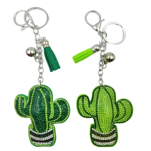 Sparkling rhinestone cactus keychain with colorful tassels and bells on white background