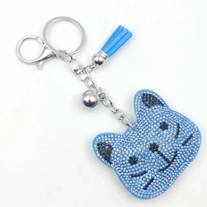 Blue rhinestone teddy bear keychain with matching blue tassel and silver bell detail