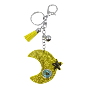 Moon and star rhinestone keychain with evil eye detail and yellow tassel charm