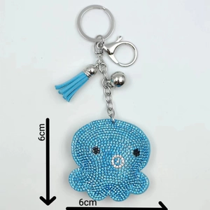 Sparkling rhinestone octopus keychain with light blue crystals and matching tassel charm
