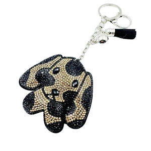 Porte-clés chien en cristal avec strass brillants, clochette et pompon en cuir noir élégant