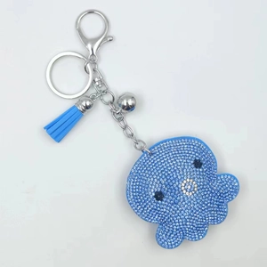 Sparkling blue octopus keychain with rhinestones, light blue tassel, and silver bell charm