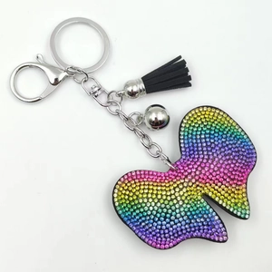 Rainbow gradient rhinestone bowtie keychain with black leather tassel and silver bell