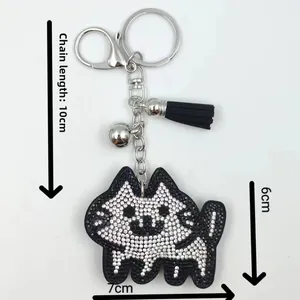 Detailed view of rhinestone dog keychain with 10cm chain length and 7x6cm dimensions