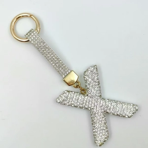Detailed view of rhinestone letter X keychain with sparkling crystals and gold metal ring