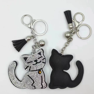 Sparkling rhinestone cat keychain with black velvet back and tassel bag charm