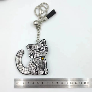 Detailed size measurement of cartoon cat rhinestone keychain with black tassel and ruler