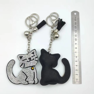 Detail view of cartoon cat keychain showing sparkling rhinestones and total length measurement