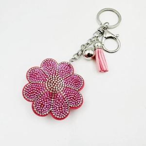 Porte-clés tournesol strass rose étincelant avec pompon et clochette en métal argenté