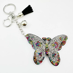 Porte-clés papillon en strass coloré avec pompon noir et clochette pour sacs