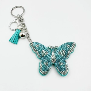 Porte-clés papillon en cristal avec strass bleu ciel et gland en cuir élégant