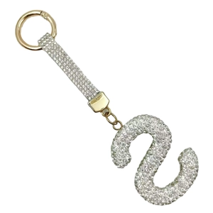 Sparkling crystal encrusted letter S keychain in gold finish with round carabiner clip