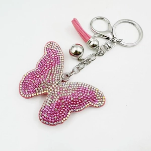 Porte-clés papillon rose avec cristaux scintillants, pendentif à pompon et fermoir homard