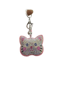Detailed view of pink cat keychain with colorful rhinestones and silver lobster clasp