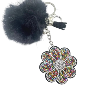 Fluffy black pompom keychain with crystal flower pendant and leather tassel for bags