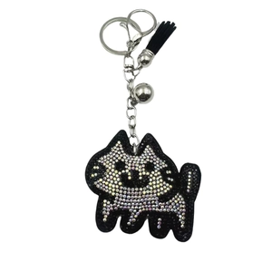 Cute cartoon cat keychain with sparkling crystals, black leather tassel, and silver bell charm