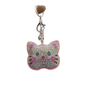 Sparkling pink rhinestone cat head keychain with silver metal lobster clasp and small bell