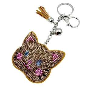 Sparkling cat head keychain with golden rhinestones, leather tassel and small bell