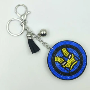 Sparkling superhero rhinestone keychain with blue and yellow gems and black tassel charm