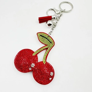 Creative cherry rhinestone velvet keychain with red tassel and silver bell accessory