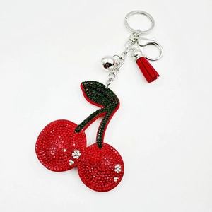 Sparkling cherry rhinestone keychain with red velvet tassel and silver bell accessory