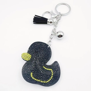 Detail of crystal duck keychain with black tassel, silver bell and lobster clasp