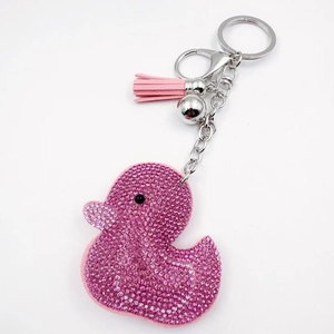 Detailed view of pink rhinestone duck keychain with soft tassel and silver metal clasp