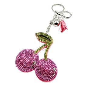 Sparkling pink rhinestone cherry keychain with green leaves, silver bell, and leather tassel