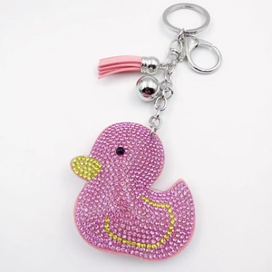 Detailed view of pink rhinestone duck keychain with silver lobster clasp and PU tassel